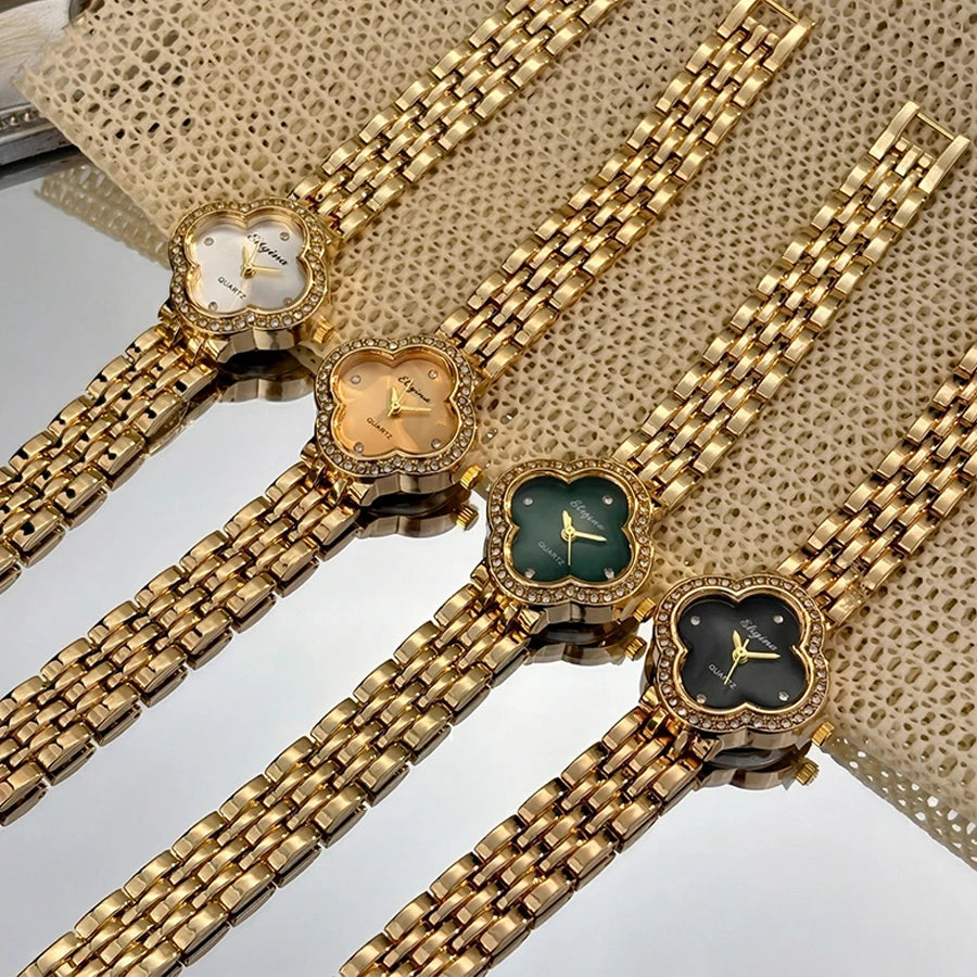 Montre délicate trèfle doré vintage pour femme avec verre bombé