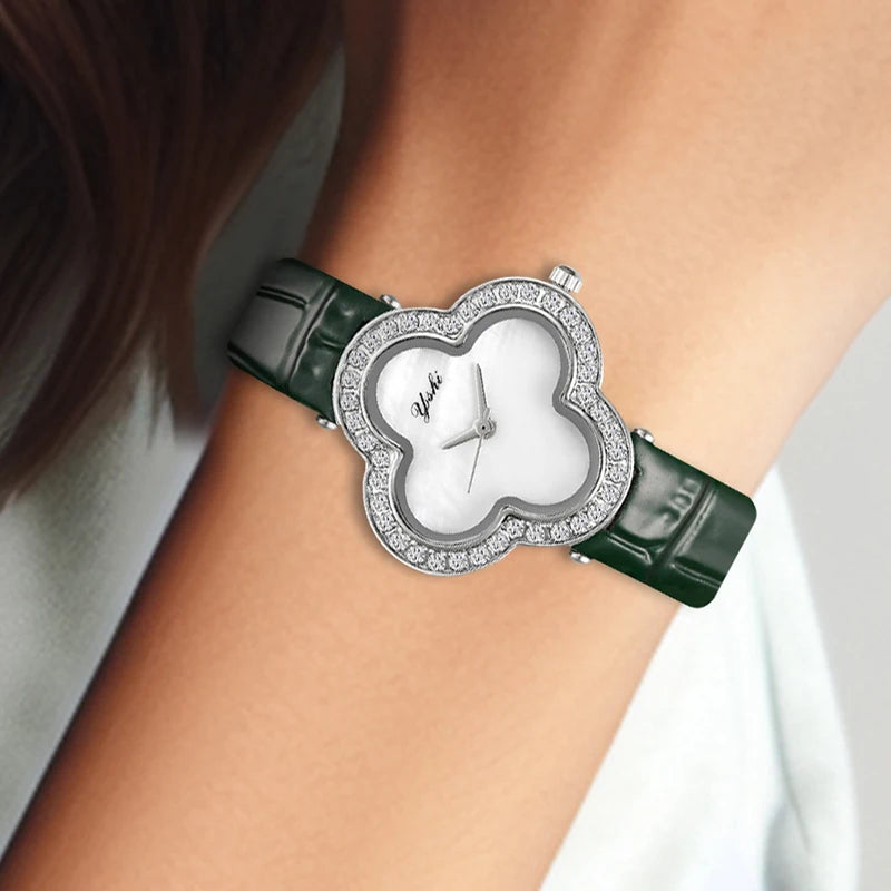 A women's modern minimalist four-leaf clover forest-style green PU leather quartz watch that brightens the skin tone
