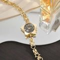 Montre pour femme en alliage, mouvement à quartz, bracelet réglable, style créatif, élégante, accessoire de mode.