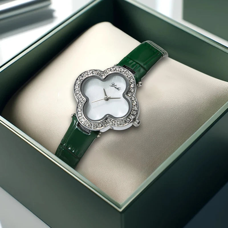 A women's modern minimalist four-leaf clover forest-style green PU leather quartz watch that brightens the skin tone